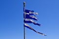 Torn Greek Flag Against Blue Sky Royalty Free Stock Photo