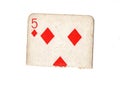 A torn half of a vintage five of diamonds playing card. Royalty Free Stock Photo