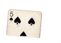 A torn half of a vintage five of spades playing card. Royalty Free Stock Photo