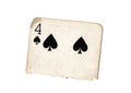A torn half of a vintage four of spades playing card. Royalty Free Stock Photo