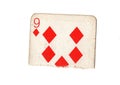 A torn half of a vintage nine of diamonds playing card. Royalty Free Stock Photo
