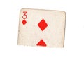 A torn half of a vintage three of diamonds playing card. Royalty Free Stock Photo