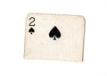 A torn half of a vintage two of spades playing card. Royalty Free Stock Photo