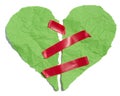 Torn heart made of green crumpled paper fastened with red electrical tape on a white background