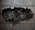 Torn hole in old metal with rusty gears and cogs Royalty Free Stock Photo