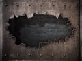 Torn hole in rusty metal steam punk background