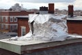 torn metal sheet from rooftop in high winds