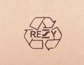 Torn out piece of cardboard with recycle symbol Royalty Free Stock Photo