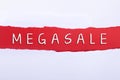 Torn paper with a MEGASALE word on red background