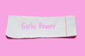 Torn paper on pink background with text Girl Power. Ripped notebook sheet. Feminism concept Royalty Free Stock Photo