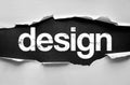 Torn paper revealing the word DESIGN in bold, distressed letters, symbolizing creativity, planning, and the structured process of Royalty Free Stock Photo