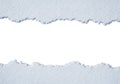 Torn paper texture revealing white space for copy or design elements Royalty Free Stock Photo