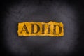 Torn piece of paper with abbreviation ADHD