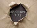 Torn piece of paper with an inscription Cognitive bias.