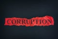 Torn piece of paper with the word Corruption Royalty Free Stock Photo