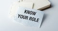 A torn piece of paper with the words Know Your Role written on it Royalty Free Stock Photo