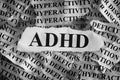 Torn pieces of paper with abbreviation ADHD