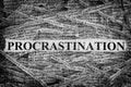 Torn pieces of paper with word Procrastination Royalty Free Stock Photo