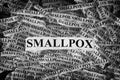 Torn pieces of paper with the words Smallpox