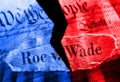 Torn red and blue Roe V Wade newspaper headline on the United States Constitution and Supreme Court Royalty Free Stock Photo