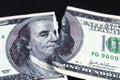 Torn ripped devalued one hundred dollar bank note. collapse of dollar. Devaluation. Falling currency Royalty Free Stock Photo