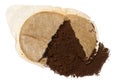 Torn round coffee pod or single serving of ground coffee wrapped in filter paper. Isolated background Royalty Free Stock Photo
