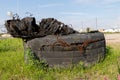 A torn tire from a truck. Old tires left on the side of the road Royalty Free Stock Photo