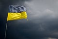 Torn Ukrainian flag on the background of a stormy Royalty Free Stock Photo