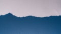 Torn White Paper Over Textured Blue Surface with Jagged Irregular Edge Composition Royalty Free Stock Photo