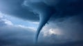 Tornado funnel cloud forming in dark spinning storm clouds, representing severe weather event and disaster Royalty Free Stock Photo