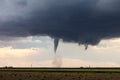 Tornado touching down in a field Royalty Free Stock Photo