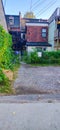 Toronto back alley with view of backyard entrance and gate. Royalty Free Stock Photo