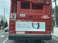 TORONTO, CANADA - APRIL 12, 2021: SIGN ON BACK OF TTC BUS RE MASK WEARING AND COVID-19 PANDEMIC.