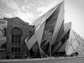 TORONTO, CANADA - 08 05 2011: Black and white image of famous modern Royal Ontario Museum buildig walking in front in a Royalty Free Stock Photo