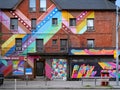 Brick wall with rainbow colors in gay village neighborhood