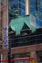 Toronto, Canada - 06 27 2016: Fancy Yonge street sign mounted on a street lamp pole shot in front of a glassy building