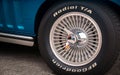 TORONTO, CANADA - 08 18 2018: Front wheel with chrome cover and BFGoorich Radial T/A tire of blue 1966 Chevrolet