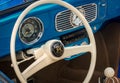 TORONTO, CANADA - 08 18 2018: Interior with steering wheel with logo, speedometer, revs dial on front panel of blue 1955 Royalty Free Stock Photo