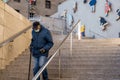 TORONTO, CANADA - JANUARY 23, 2021: OLDER MAN WEARING MASK ON STEPS DURING COVID-19 PANDEMIC.