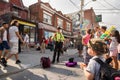 TORONTO, ON, CANADA - JULY 29, 2018: A child watches a street performer at Kensington market in Toronto.