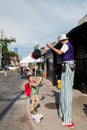 TORONTO, ON, CANADA - JULY 29, 2018: A child watches a street performer at Kensington market in Toronto.