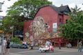 Toronto, Canada Ã¢â¬â July 9, 2017: Kensington Market street in Toronto with art nouveau graffiti, abandoned car with growing plants