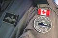 Flag of Canada and Griffon, Royal Canadian Air Force on a pilot soldier uniform, NATO Royalty Free Stock Photo