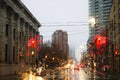 TORONTO, CANADA - NOVEMBER 18, 2017: Street in the rain at evening in the light from traffic light and car lights in Toronto Downt Royalty Free Stock Photo