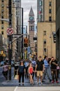 TORONTO, CANADA - 06 28 2016: People waiting at the crosswalk on Bay street in downtown Toronto with Old City Hall Clock Tower in Royalty Free Stock Photo