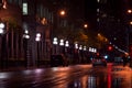 Toronto, Canada - 10 30 2021: Rainy night view along Wellington street from Yonge street in downtown Toronto with a line