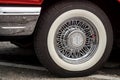 TORONTO, CANADA - 08 18 2018: Shiny chrome True Classic spoked wheel disk with painted in white Coker Classic tire of an