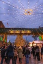 The Toronto Christmas Market Winter Village at the Distillery District. Tree and lights over the Gooderham and Worts sign.