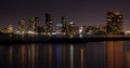 Toronto City skyline at night, clear dark sky, colorful light reflection in the calm water surface of lake Ontario. Royalty Free Stock Photo