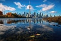 Toronto city skyline reflected in the water with autumn leaves. Ontario, Canada, CN tower and Toronto Harbour reflection, AI Royalty Free Stock Photo